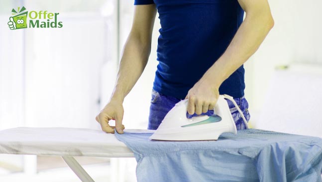 shirt ironing on the top of table using iron box